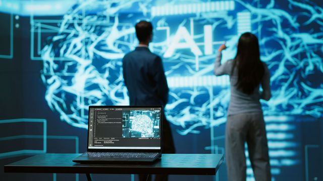 Engineers use AR tech to visualize AI neural networks brain, solving company problems. IT professionals using artificial intelligence augmented reality hologram