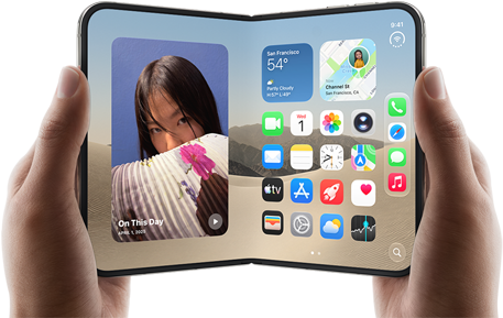 iPhone Duo, Star White colour, held by two hands in landscape orientation, unfolded, interior screen displays photos on the left, apps on the right
